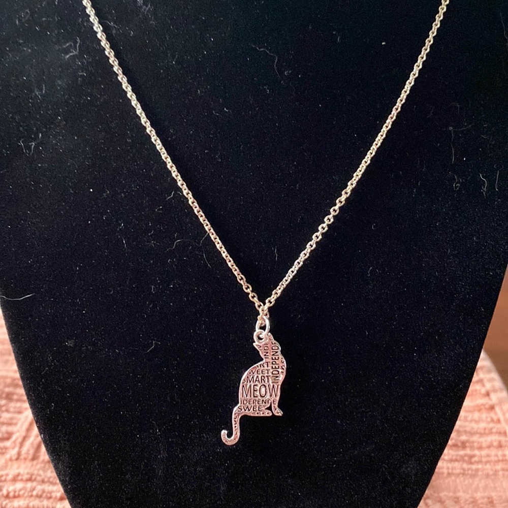 Cat pendant on silver necklace